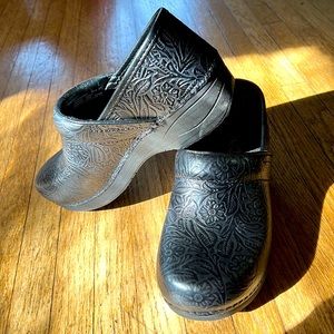 Dansko black leather clogs with floral print